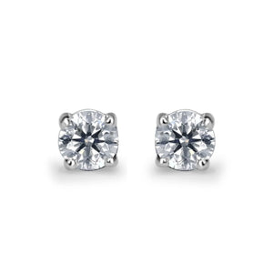 The Nora by DX Diamonds is a pair of solitaire earrings with lab-grown diamonds in 9ct white gold prongs, featuring round gemstones that exude timeless elegance and sophistication.
